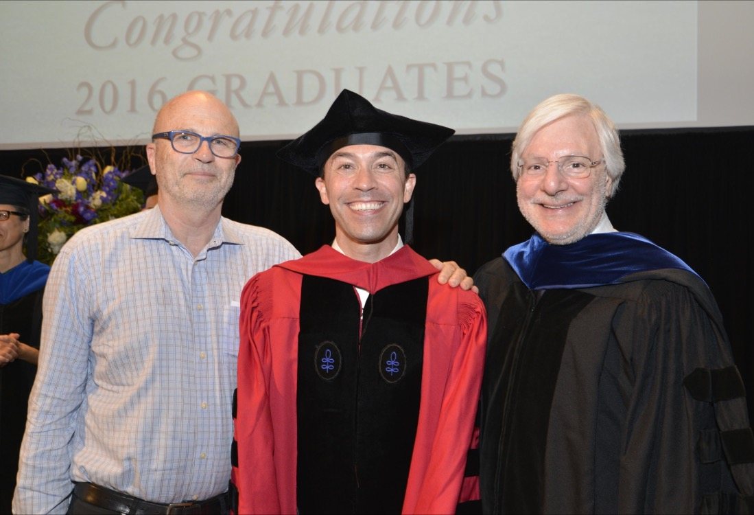 David Roberson in crimson Harvard doctoral robes at commencement