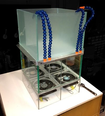 The open-field odor delivery chamber David built, with blue odor nozzles above exhaust fans